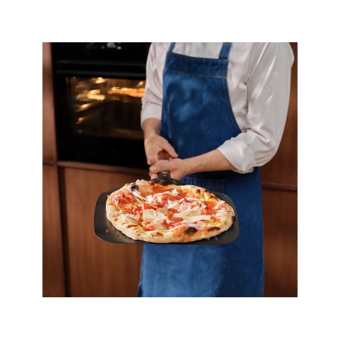 Person holding the pizza expert pizza peel with a Neapolitan pizza