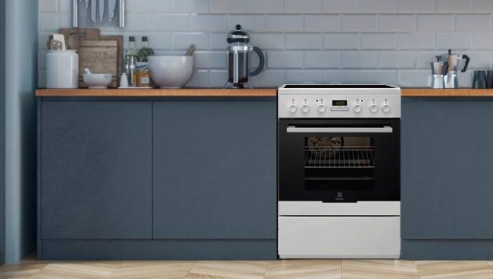 An Electrolux cooker with an oven is placed in a stylish kitchen environment